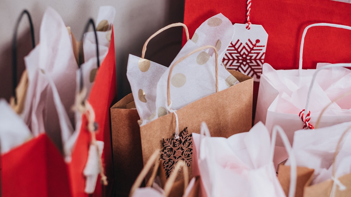 Stack of shopping bags and boxes representing multiple purchases
