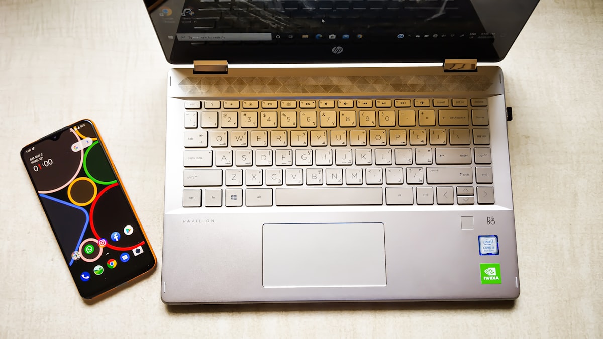 Refurbished smartphone and laptop displayed for sale