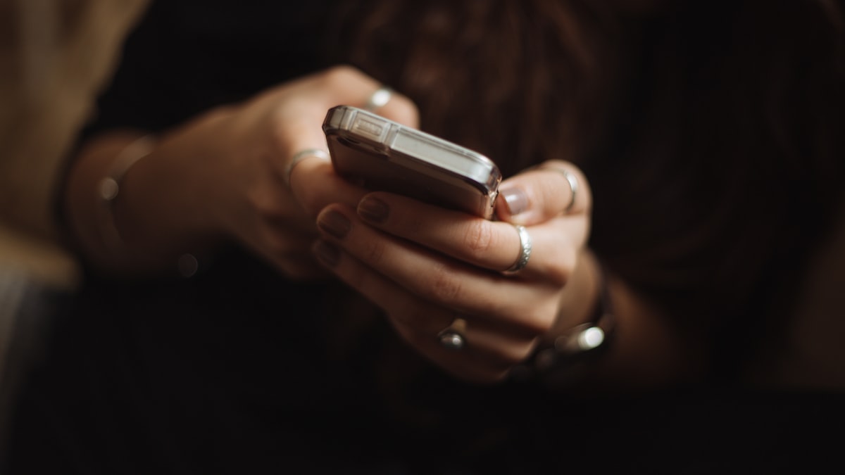 Person browsing a shopping wishlist on a phone